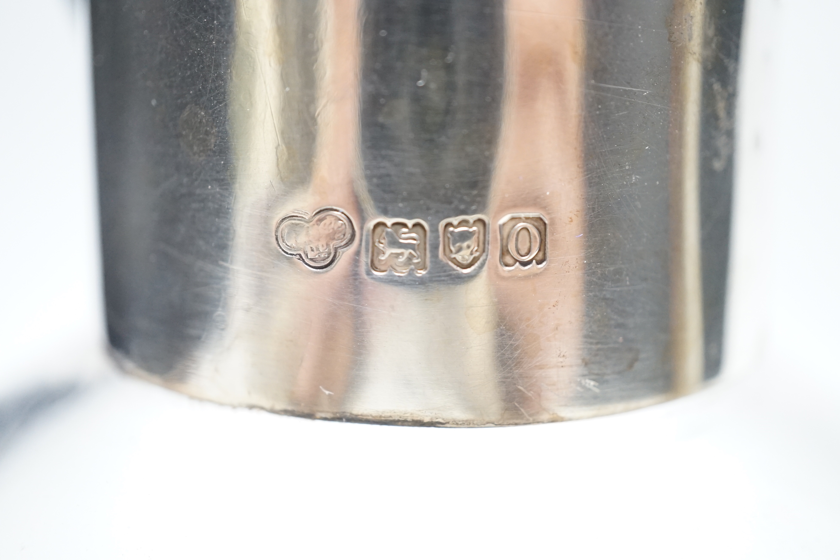 An Edwardian silver mounted glass claret jug, in the manner of Christopher Dresser, Goldsmiths & Silversmiths Co Ltd, London, 1909, 19.5cm.